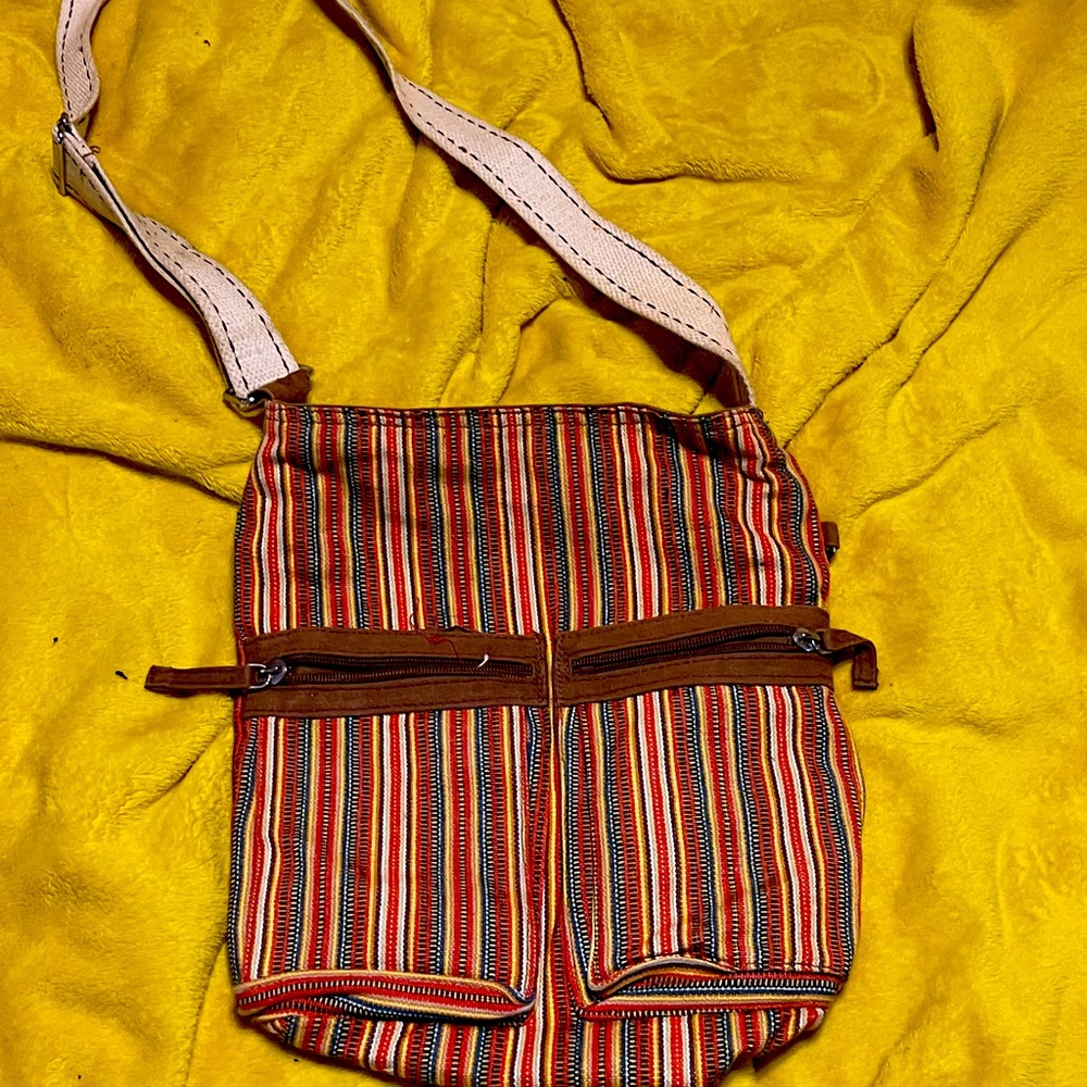 Crossbody multicolored striped purse.